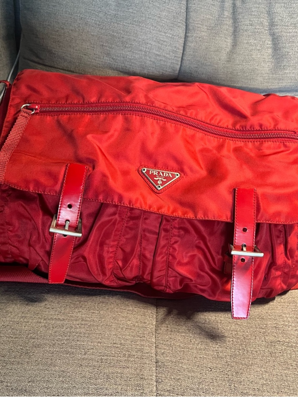 Red Prada messenger Bag … size 11x16. Holds a lot .  Great condition